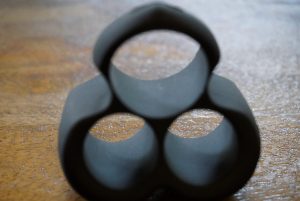 A photo of the Hot Octopuss Jett main silicone component with three holes for the 2 bullets and the penis.